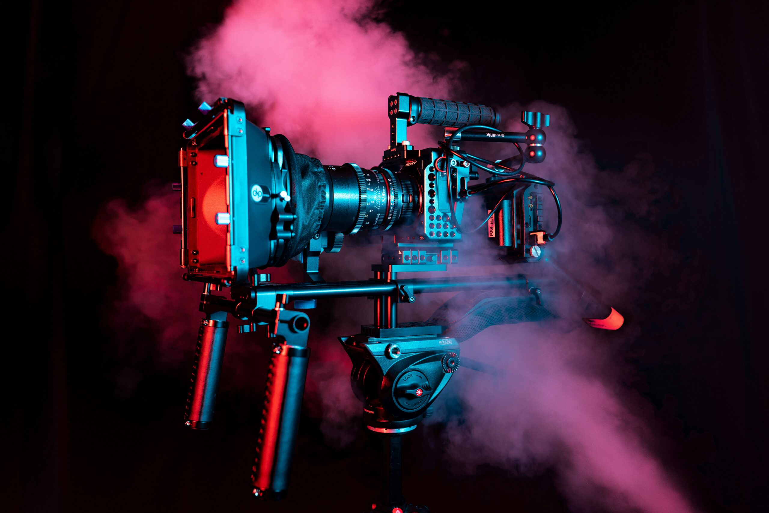 large video camera covered in misty smoke