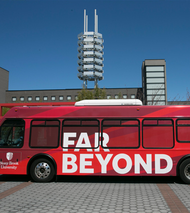 Stony Brook bus showing the branded slogan Far Beyond on its side