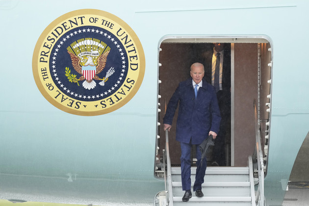 President Joe Biden walks down the steps of Air Force One upon arrival to Japan. 