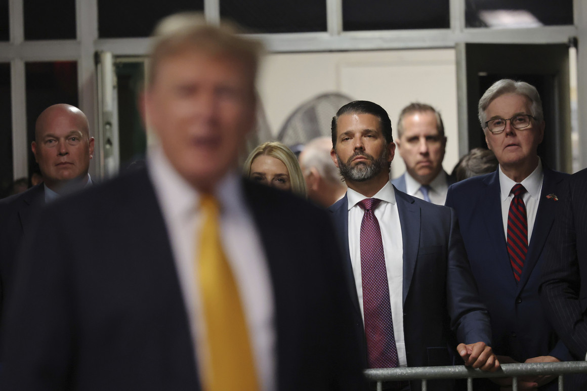Former acting U.S. Attorney General Matt Whitaker (from left), Donald Trump Jr. and Texas Lt. Gov. Dan Patrick watch as former President Donald Trump speaks after a break during his trial at Manhattan Criminal Court on May 21 in New York.