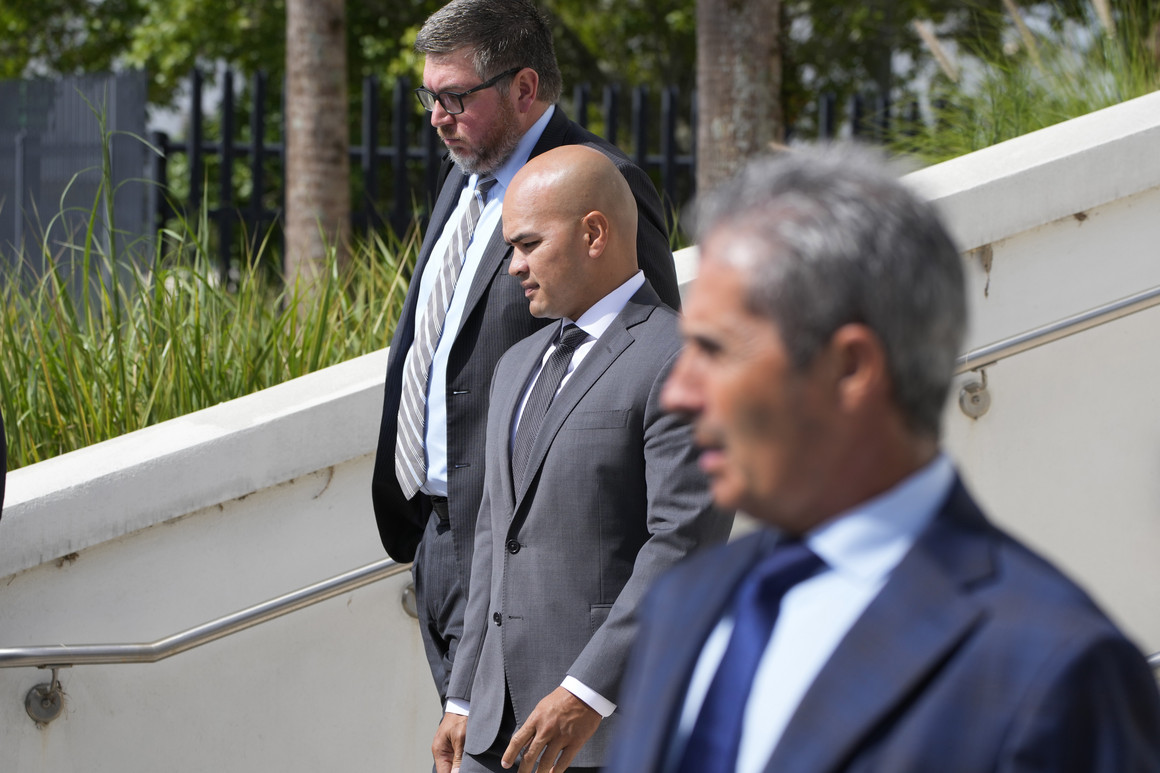 Walt Nauta (center) valet to former president Donald Trump, his attorney Stanley Woodward (rear) and Carlos De Oliveira, foreground, the property manager of Trump's Mar-a-Lago estate, leave the Alto Lee Adams Sr. U.S. Courthouse.