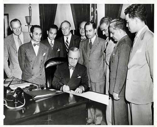 Truman signing the Luce-Celler Act