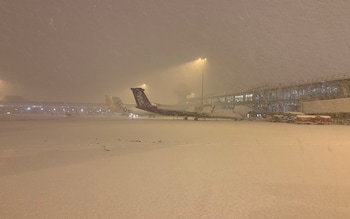 Manchester Airport covered in snow