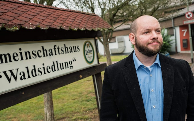 Stefan Jagsch of the far right-wing extremist National Democratic Party (NDP) poses for a photo in from of the community house in Altenstadt-Waldsiedlung, on September 8, 2019