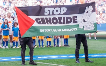 A banner asking to stop the Palestinian genocide is displayed before the UEFA Women's Champions League final match between FC Barcelona Femeni and Olympique Lyonnais Feminin