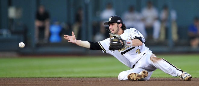 2015: Dansby Swanson - Vanderbilt's Dansby Swanson tosses the ball to second during the 4th inning against Virginia in the last game of the College World Series at TD Ameritrade Park, Wednesday, June 24, 2015, in Omaha, Neb.