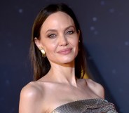 Angelina Jolie in a silver Versace dress on the red carpet for Marvel's Eternals