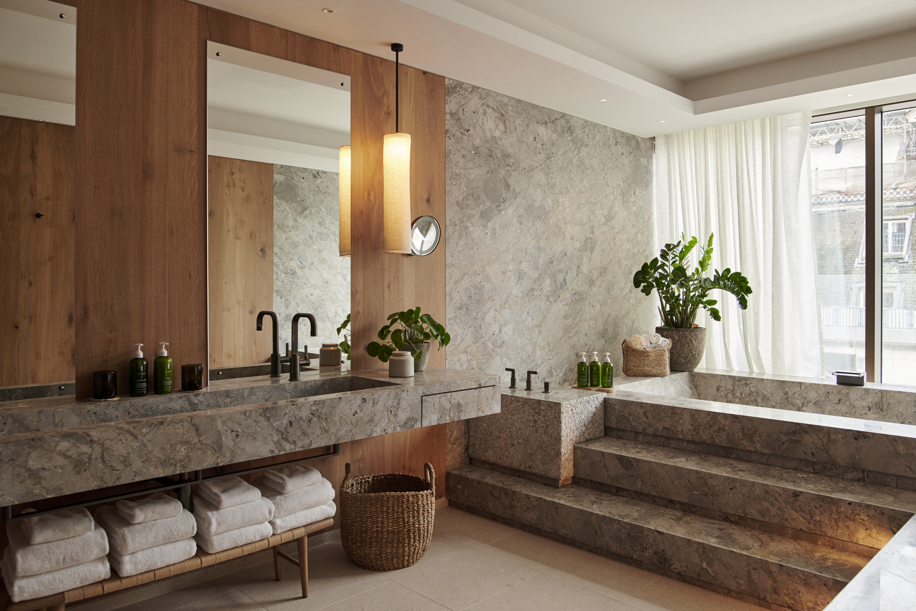 The floor and walls in the penthouse bathroom are crafted from Italian marble