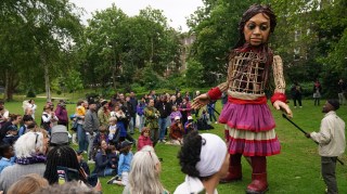 Little Amal, a 4m tall puppet of a ten-year-old Syrian refugee, who represents all children fleeing war, violence and persecution, in Merrion Square in Dublin