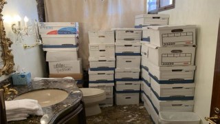 This photograph was included as evidence in the indictment against Donald Trump, showing stacks of document boxes in a bathroom and shower allegedly in the Lake Room at Mar-a-Lago, his private club in Florida