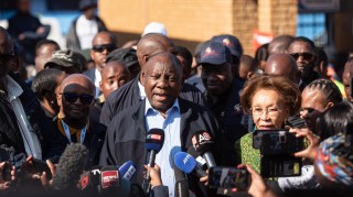 President Ramaphosa outside Hitekani Primary School in Soweto township after casting his ballot. Polls suggest his ANC party may stay above 45 per cent of the vote