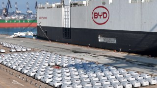 BYD electric cars for export wait to be loaded on to a container vessel at Yantai port in eastern China