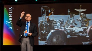 Charlie Duke, 88, at the Starmus science festival in Bratislava, with a photo of him on the moon in 1972. He is advising Nasa ahead of the Artemis II and Artemis III missions