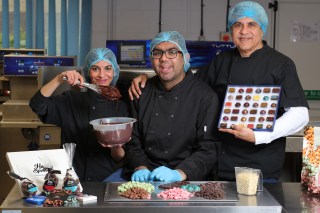 Mona and Shaz Shah with their son Ash, who has autism. Their chocolate company, Harry Specters, employs people who have autism across the business
