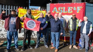 Mick Whelan, the general secretary of Aslef, centre, joins union members on the picket line at Waterloo station