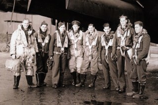 Bell, second right, with a bombing crew. He had wanted to be a pilot but at 6ft 4in the RAF considered him too tall