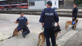 Sniffer dogs were waiting at the next station after a woman called the police over what she believed to be a warning of an imminent attack