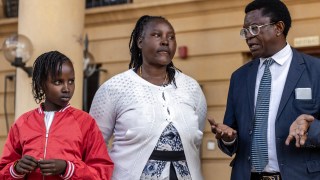 Stacey Wanjiru, 12, with her aunt, Rose Wanyua, and Mbiyu Kamau, the family lawyer