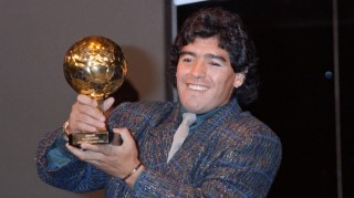 Maradona with the Golden Ball award after the 1986 World Cup, at which he scored five goals
