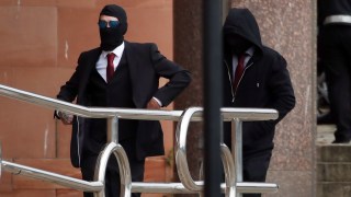 The men accused of felling the tree wore face coverings as they arrived at Newcastle magistrates’ court