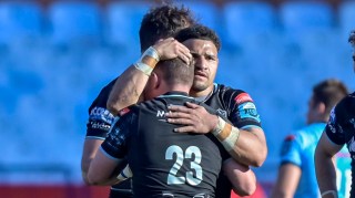 Weir, left, and Tuipulotu embrace following the defeat by the Bulls, but Glasgow remain top of the URC