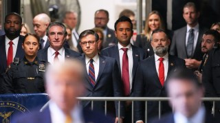 From left: the congressman Byron Daniels; Doug Burgum, governor of North Dakota; Mike Johnson, the House speaker; the onetime presidential candidate Vivek Ramaswamy and the congressman Cory Mills turned up on Tuesday to support Trump. Lara and Eric Trump are in the far-right background