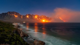 Eric Nathan’s 30-second exposure of a wildfire burning in the mountains of Kogelberg nature reserve in South Africa is one of the shortlisted entries for Earth Photo 2024, which aims to provoke discussion about the environment and climate. Nathan has been taking pictures from the same location for many years