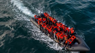 A dinghy carries migrants across the Channel this week. BBC staff said colleagues shied away from stories on the impact of migration