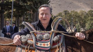 The riding enthusiast Cameron is presented with a ceremonial saddle in Ulan Bator, the Mongolian capital