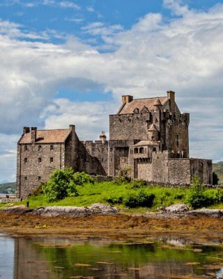 Eilean Donan Castle sits on a small tidal island where Loch Duich, Loch Long and Loch Alsh meet