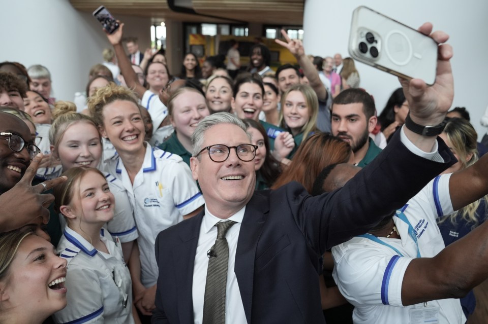 Sir Keir Starmer takes a selfie with student nurses and trainee medics during his visit to Three Counties Medical School in Worcester on Wednesday