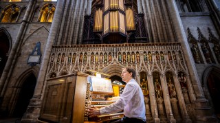 Tim Harper, assistant director of music, plays the mobile organ console at Ripon Cathedral, North Yorkshire, where a  summer organ festival will be held in June