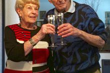 Older couple sharing glasses of wine