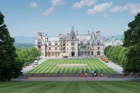 Groups of tourists arrive on the estate grounds at Biltmore House during Biltmore Blooms in Asheville, North Carolina