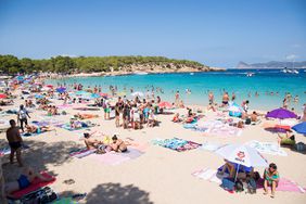 People Enjoy the Beach in Ibiza