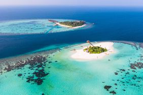 Aerial drone view of a tropical island in the Maldives