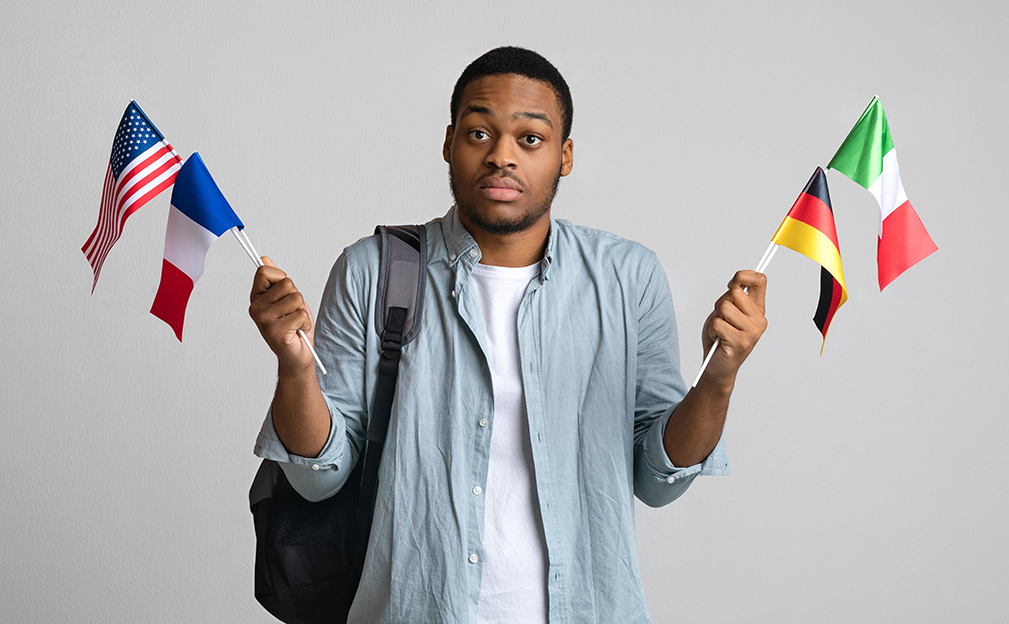 Male student considering which country to study in