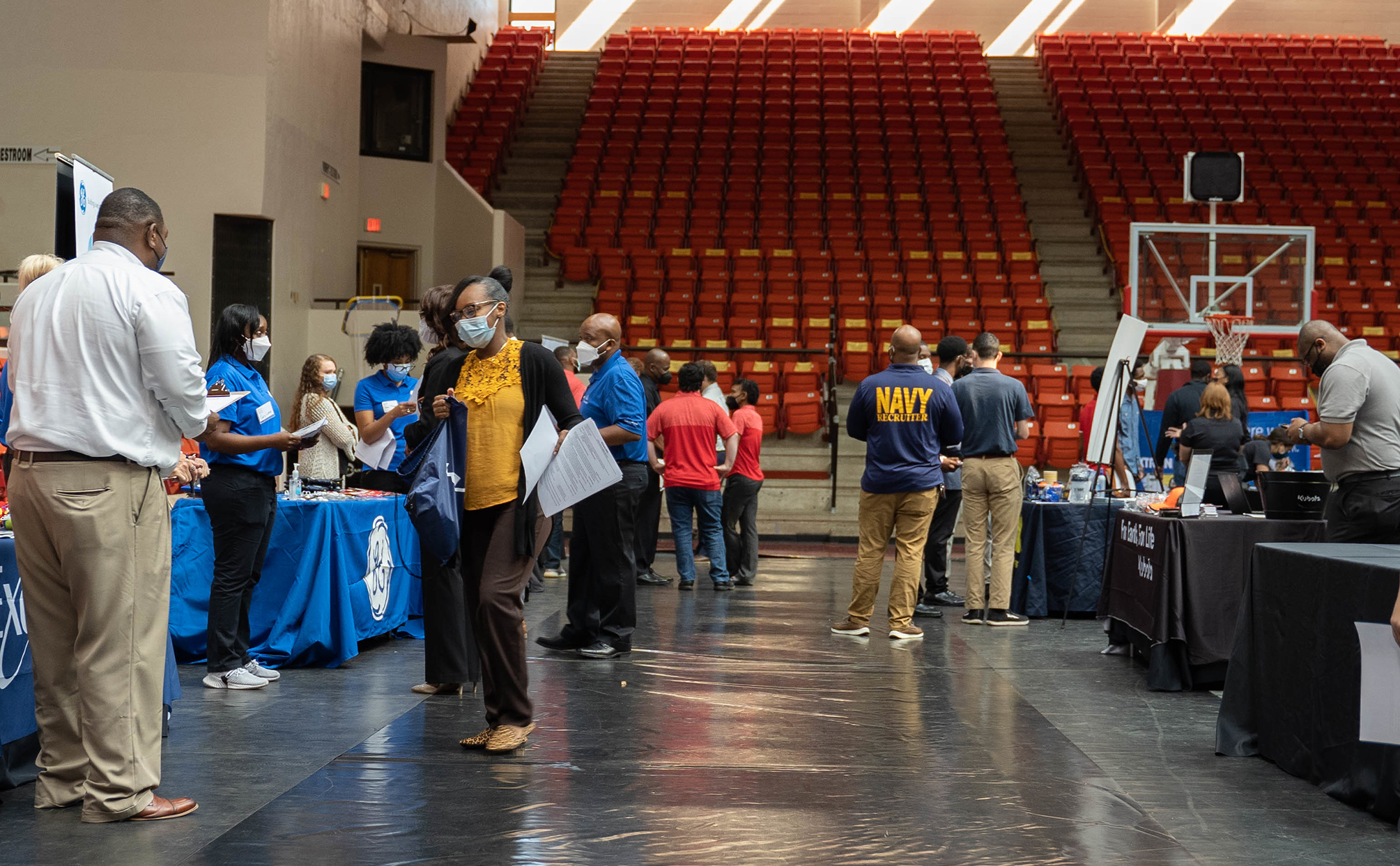 Students attending a career fair inside the arena