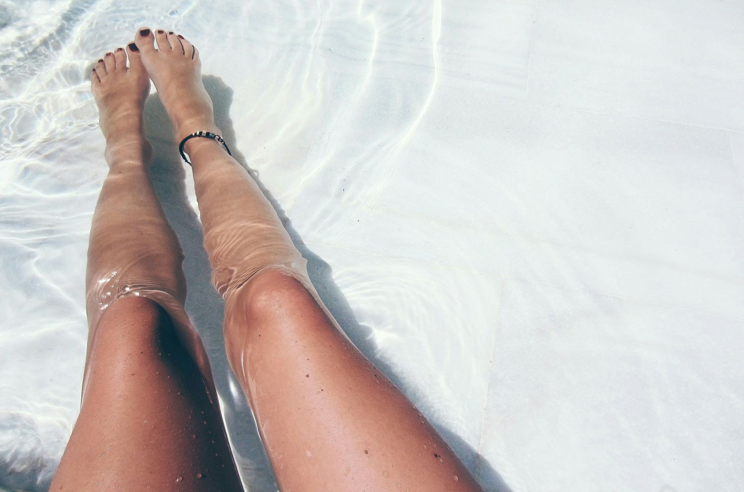 A woman's legs in a pool