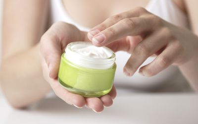 moisturizer in woman's hands