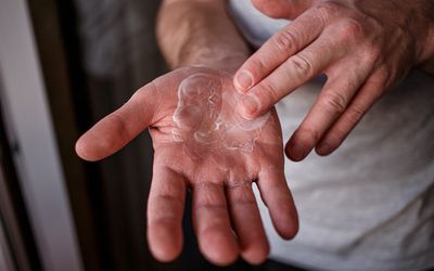 Man moisturizing hands