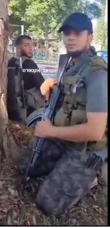 Armed Hamas terrorists in an Israeli community 