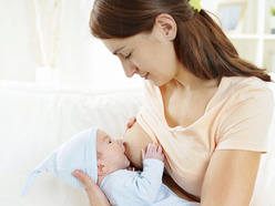 woman breastfeeding young baby