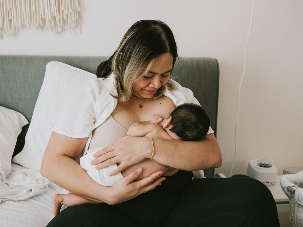 A woman breastfeeding a baby
