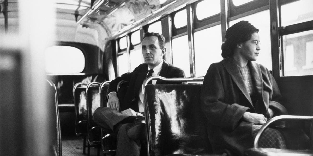 Rosa Parks sitting in the front of a bus in Montgomery, Alabama, after the Supreme Court ruled segregation illegal on the city bus system on December 21st, 1956. (Credit: Bettmann Archive/Getty Images)