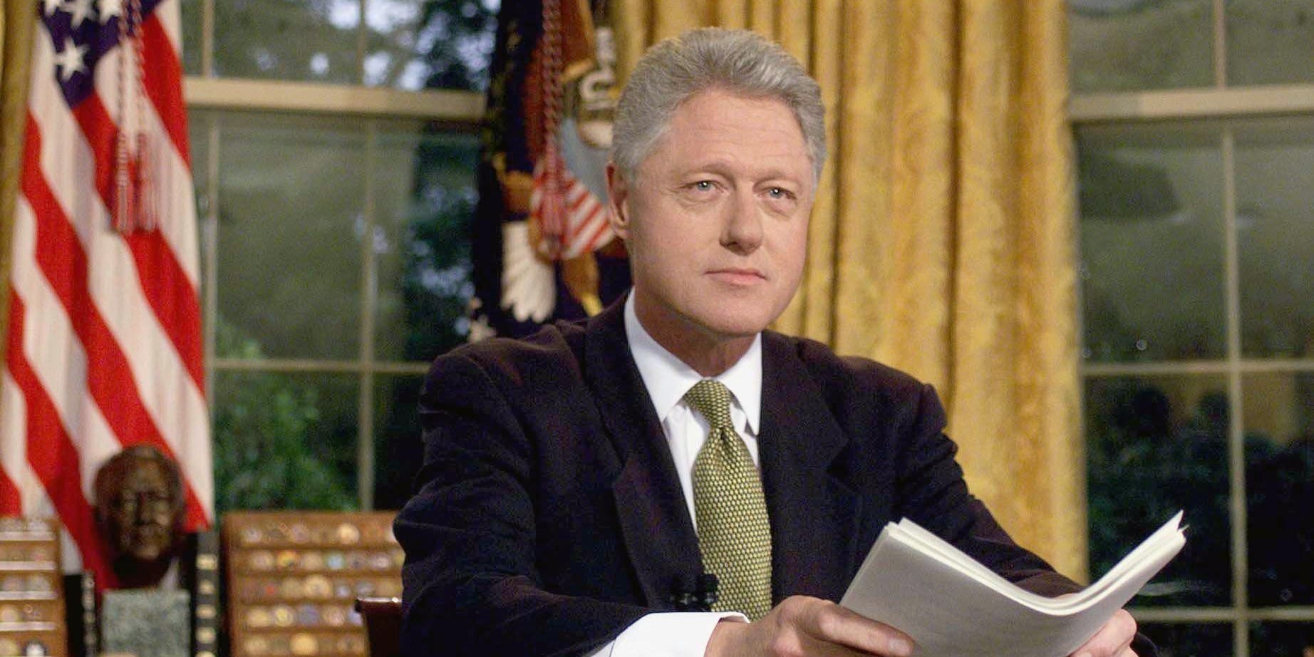 U.S. President Bill Clinton poses for photographs after addressing the nation from the Oval Office in the White House 10 June, 1999, following the end of hostilities in Yugoslavia.