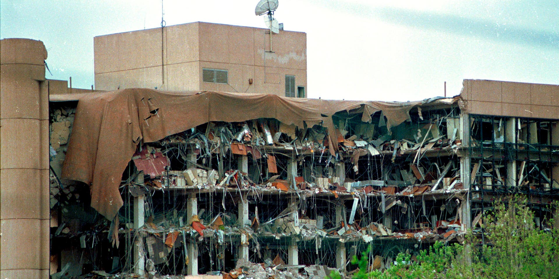 Oklahoma City BombingN220195 02: FILE PHOTO: Protective covering drapes over the Alfred P. Murrah Federal Building in Oklahoma City, April 19, 1995 where a terrorist bomb killed 168 people. On the fifth anniversary of the bombing, survivors, victims'' family members, friends and rescue personnel gathered at the bombing site April 19, 2000 to officially dedicate a national park built to honor the people killed in the 1995 bombing. (Photo by J. Pat Carter/Liaison)