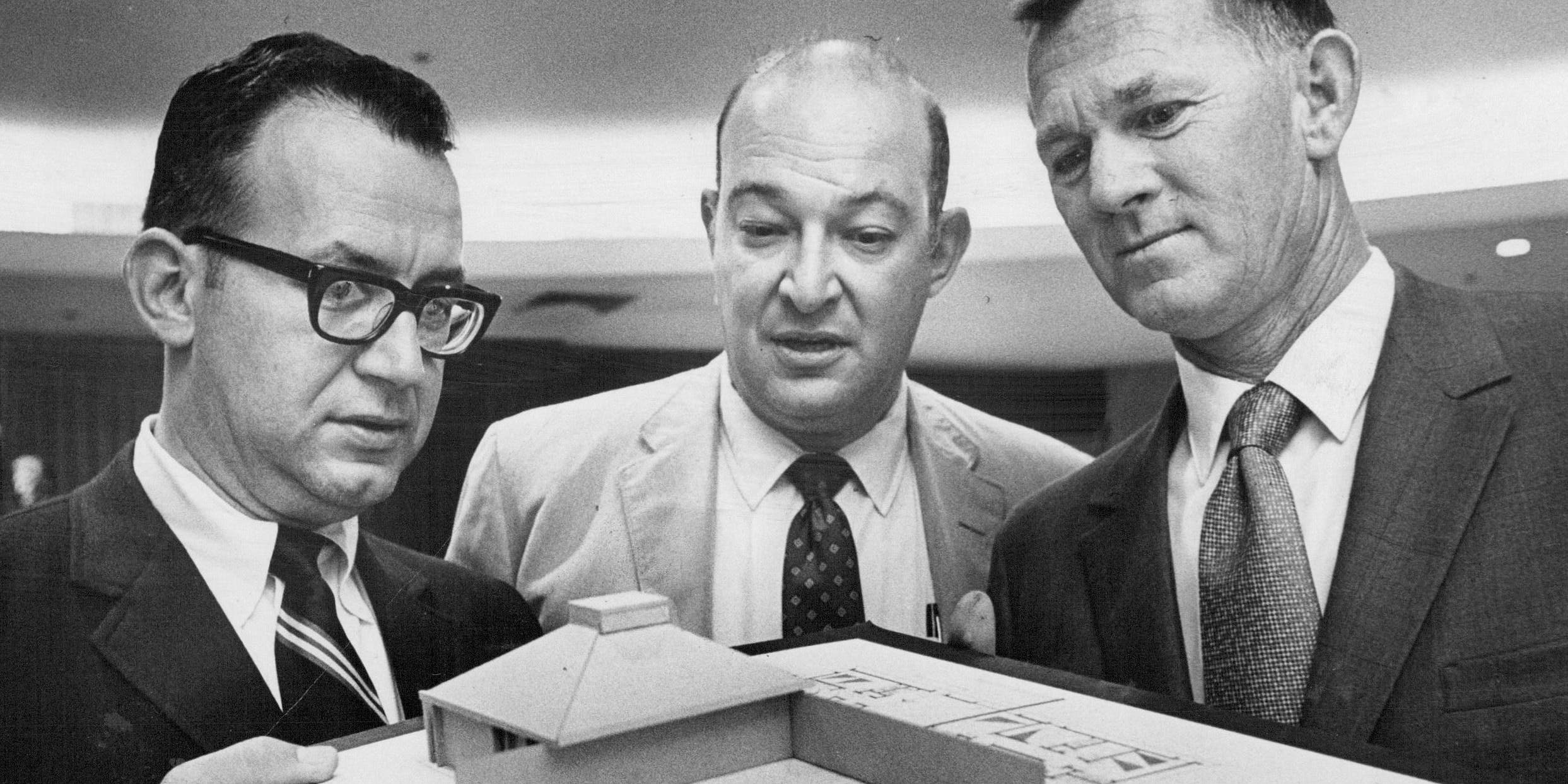 AUG 28 1969 Model Of the Four- Unit Housing Complex is on Display At Coalition Meet Around it are, from left, Charles Henning, Ed Lashman and Warren Shannon.