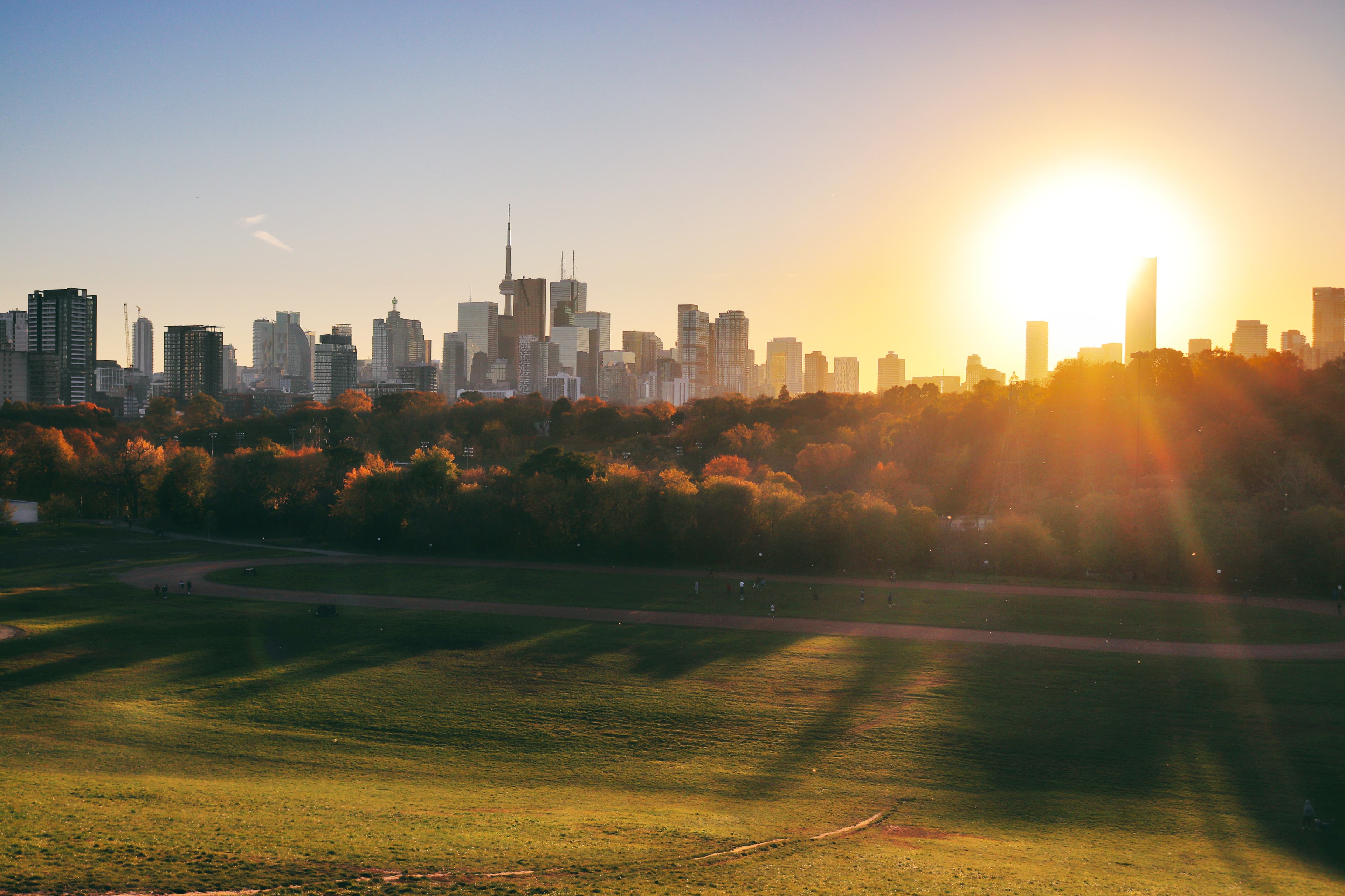 Gorgeous sunset in Toronto on a lovely day in November. The characteristic Toronto skyline with the famous CN tower grace the horizon. As seen from Riverdale Park East, Broadview.