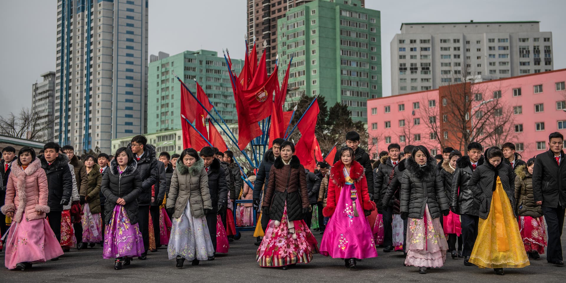 Daily Life In North Korea PYONGYANG, NORTH KOREA - FEBRUARY 08: North Koreans, including women in traditional Korean hanbok dresses, prepare to take part in a mass dance to mark the 71st anniversary of the Korean Peoples Army on February 08, 2019 in Pyongyang, North Korea. U.S President Donald Trump and North Korean Supreme Leader Kim Jong Un will hold a second summit in the Vietnamese capital of Hanoi later this month following a historic summit in Singapore last June. Although the two countries remain technically at war and with negotiations surrounding the details of North Korea's nuclear disarmament continuing, President Trump has hailed Kim Jong Un and North Korea with a tweet in which he predicted that the country would become "a great economic powerhouse" thanks to Mr Kim's leadership. (Photo by Carl Court/Getty Images)